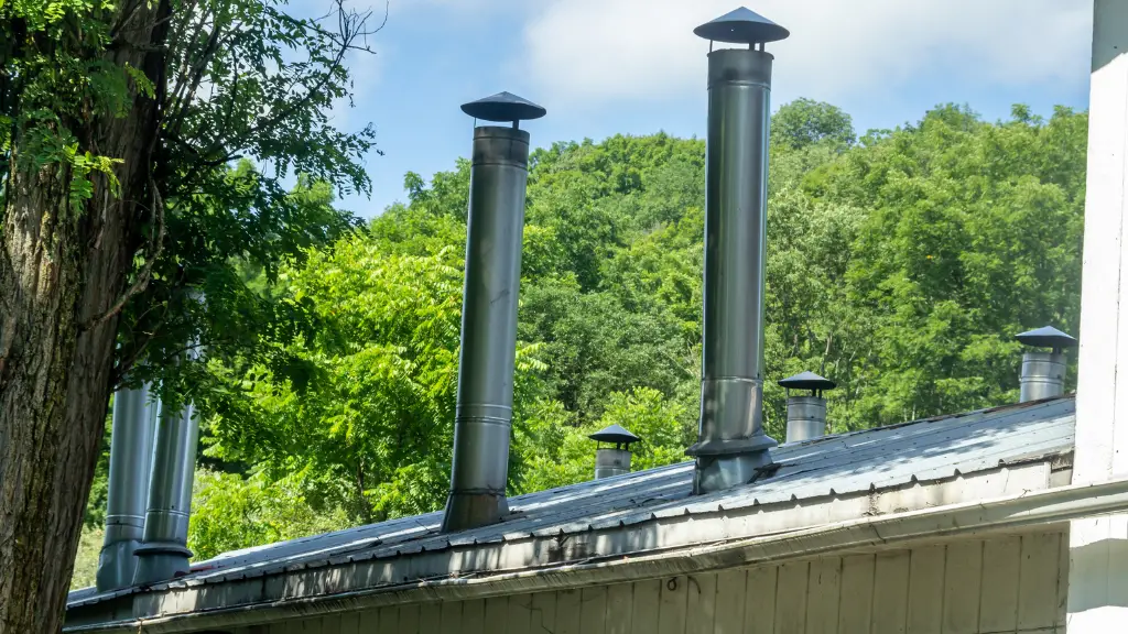 how to install wood stove pipe through metal roof