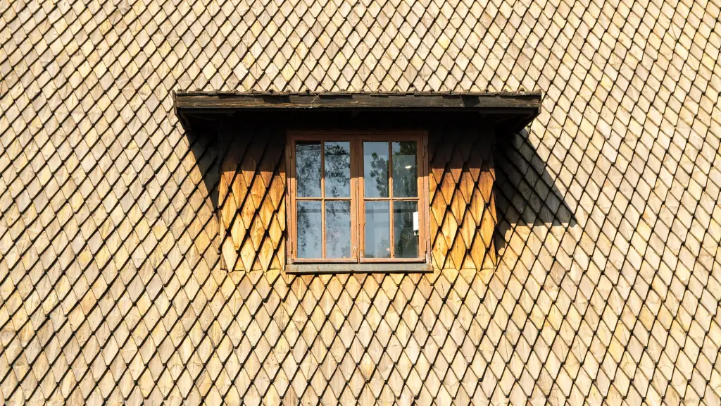 Steep old shingle roof with a window