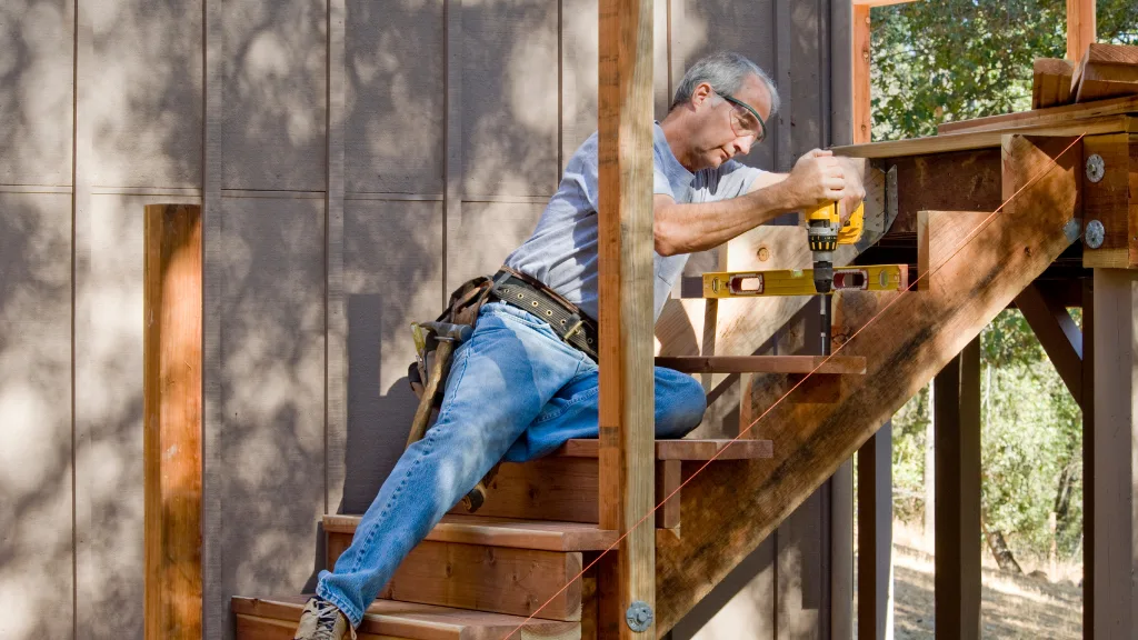 Carpenter Installing Deck Stairs