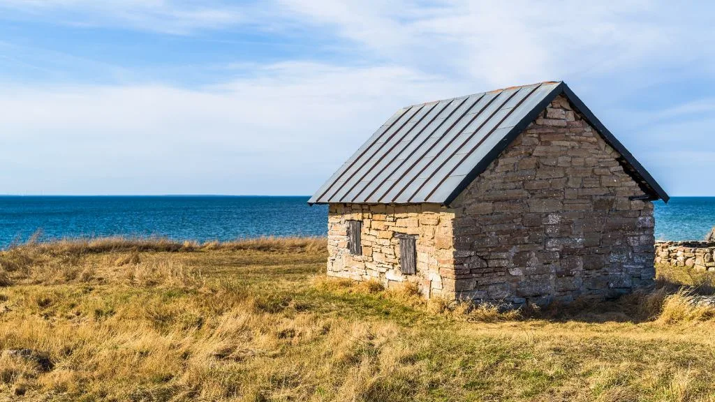 Coastal stone shed with metal roof